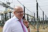 Wirtschaftsminister Altmaier vor Stromleitungen auf Netzausbaureise
