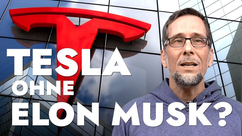 Aufmacherbild: Volker Quaschning im grauen Kapuzenpulli, hinter ihm eine Glasfassade mit dem Tesla-Logo.
